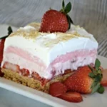 A heavenly slice of Strawberry Lasagna, showcasing layers of vibrant strawberries and creamy goodness.