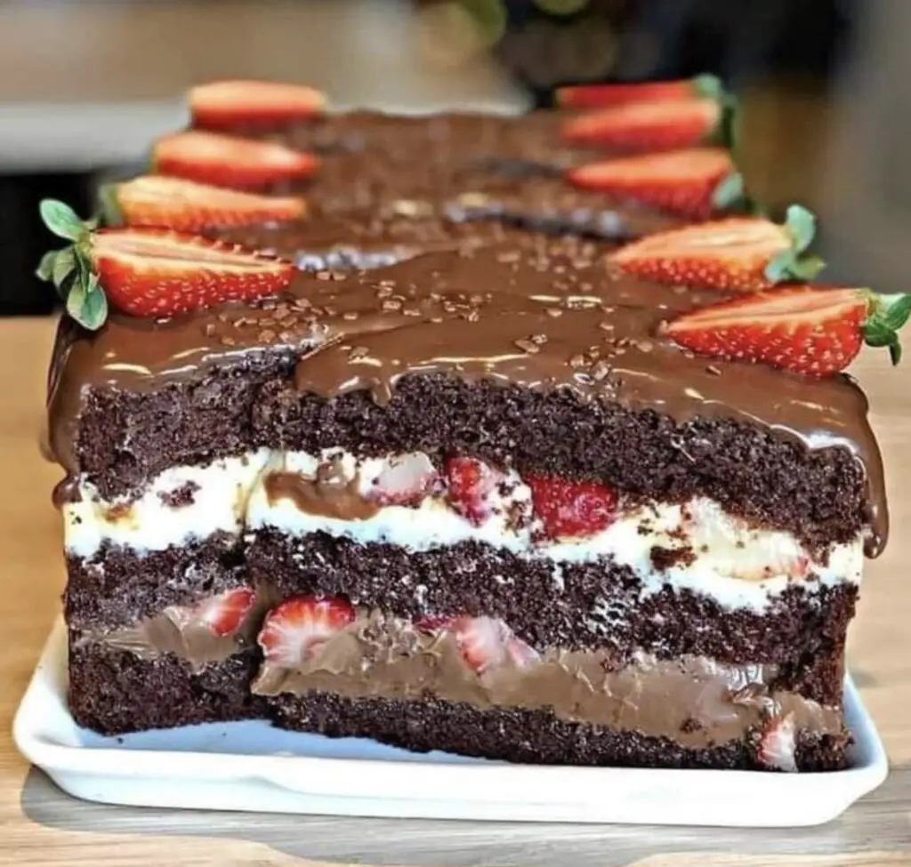 This dessert is a symphony of flavors and textures that will leave your taste buds dancing. The rich, moist chocolate cake perfectly complements the sweet and juicy strawberries,
