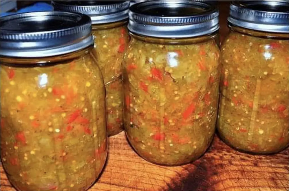 A charming image featuring jars of Old-Fashioned Chow Chow, showcasing vibrant pickled vegetables immersed in a golden-hued brine. The jars exude a rustic charm, promising a taste of Southern tradition in every spoonful.