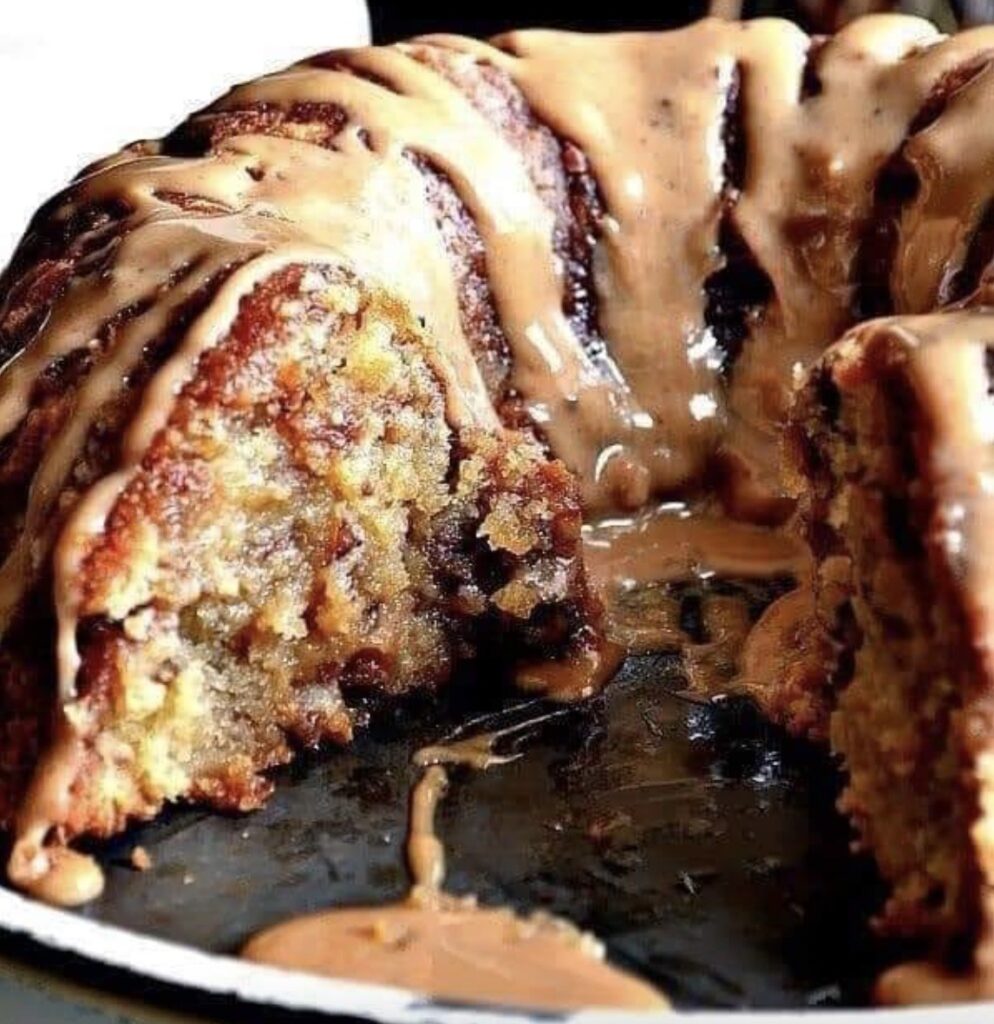 A tempting image featuring a beautifully glazed Brown Sugar Caramel Pound Cake, with the caramel drizzle cascading down the sides. Each slice promises a moist crumb and a burst of sweet sophistication.