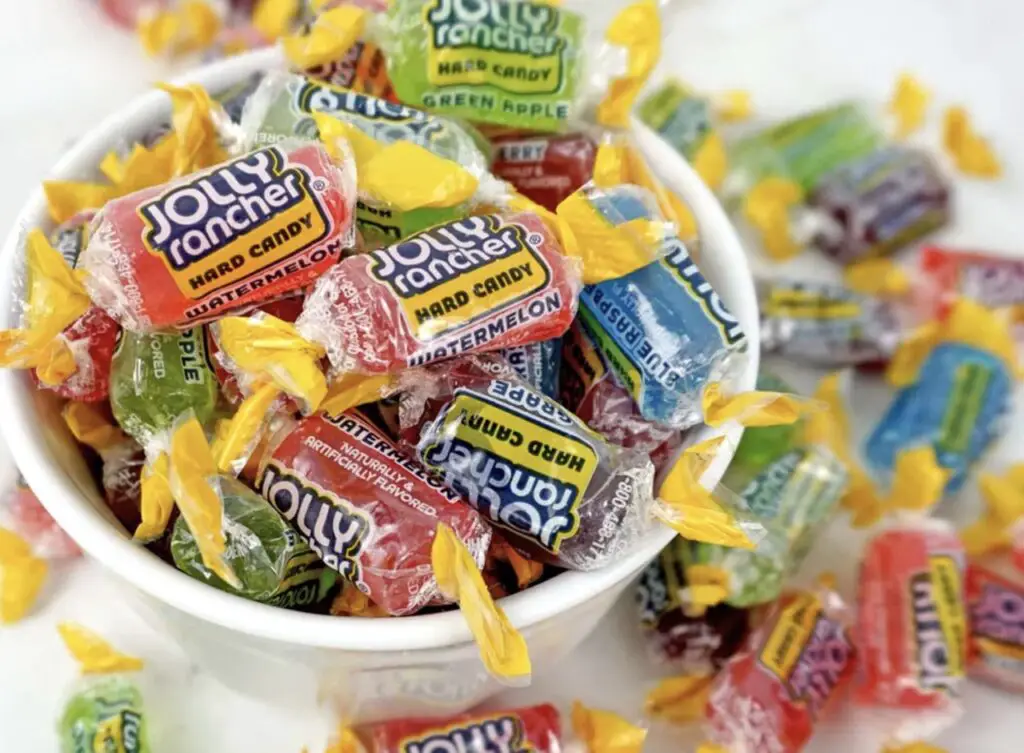 Colorful Jolly Ranchers candies arranged on a white background