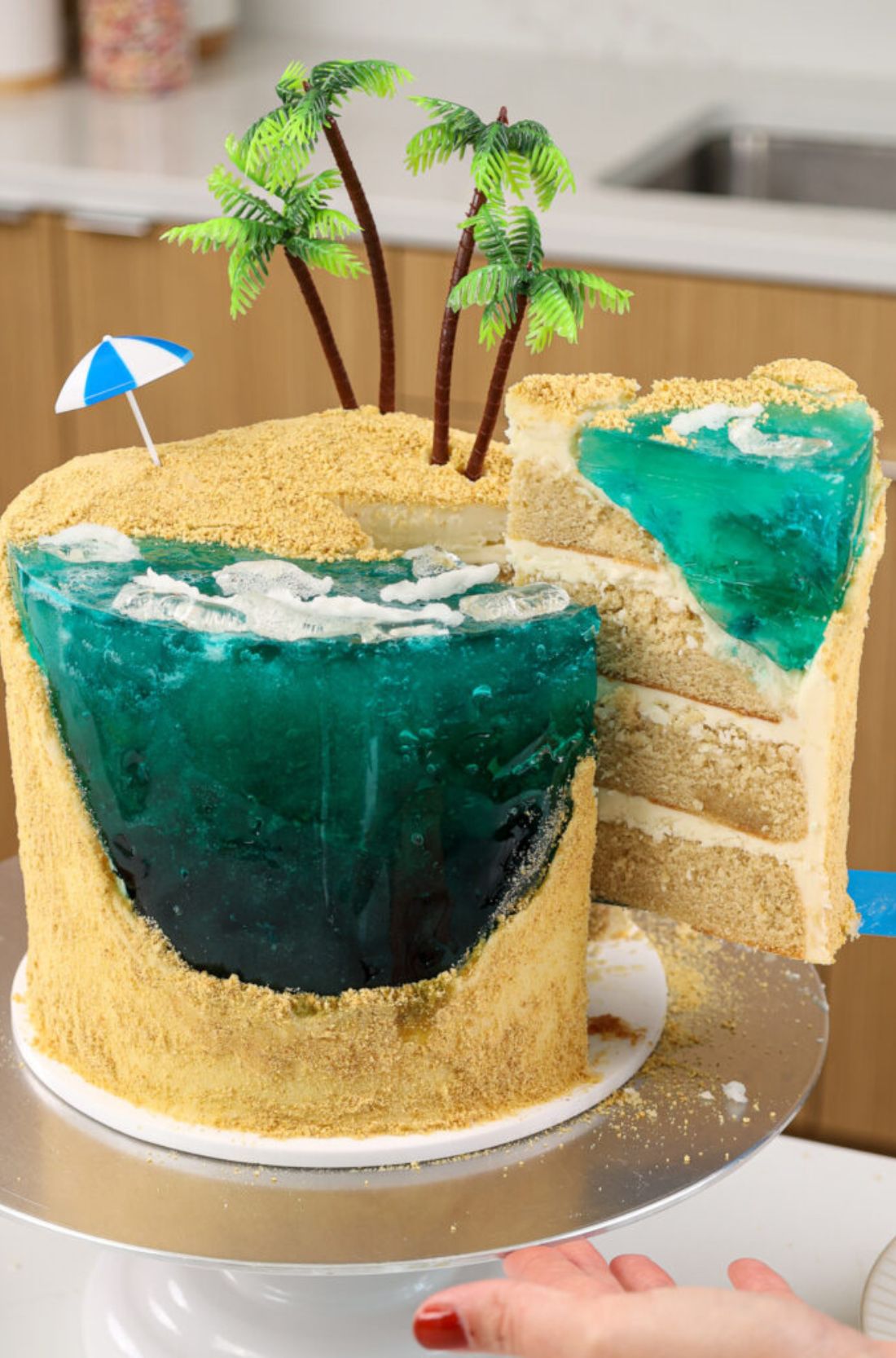 Beach Cake: A visually stunning creation with blue-tinted frosting, edible seashells, and a sandy beach base. Perfect for seaside celebrations and tropical indulgence.